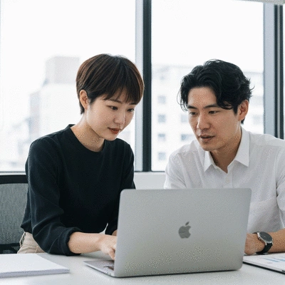Two people collaborating on a laptop in an office setting, discussing SEO strategies, no text, no words, no typography, 8K